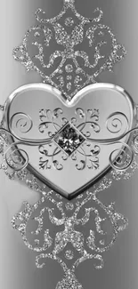 Silver heart wallpaper with intricate, glittering design.