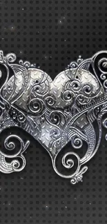 Elegant silver heart on textured black background wallpaper.