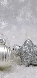 Elegant silver and white holiday wallpaper with ornaments.