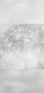 Elegant silver sparkle wallpaper with bokeh and shimmering effects.