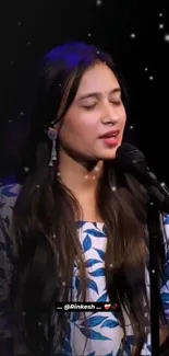 Woman singing under a starry night sky.