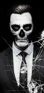 Stylish man with skeleton-painted face in a suit on a dark background.