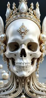 Ornate skull with pearls and gold on wallpaper.