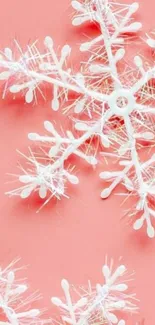 Elegant white snowflake on coral background wallpaper.