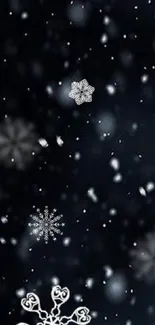 Snowflakes on a black mobile wallpaper background.