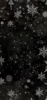 Elegant dark wallpaper with shimmering snowflakes.