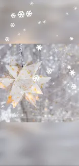 Glowing star ornament with snowflakes in soft gray winter scene.