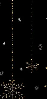 Elegant golden snowflakes on black mobile wallpaper.