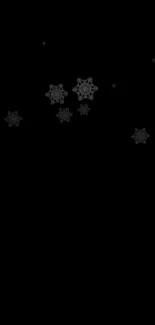 Black mobile wallpaper with elegant snowflakes.