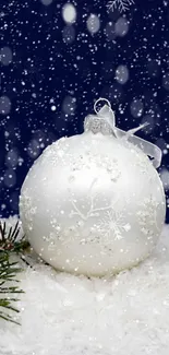 Christmas ornament with snowy background, perfect for winter wallpaper.