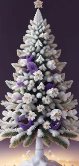 Snowy Christmas tree with purple flowers and elegant decorations.