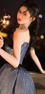 Woman in elegant dress holding sparkler against city lights.