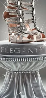 Glamorous shoe on silver pedestal with sparkling gems.