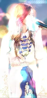 Elegant performer on stage with microphone, wearing stylish blue and white costume.