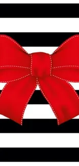 Red bow on black and white striped background wallpaper.