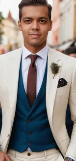 Man in cream suit and blue vest, outdoors fashion.