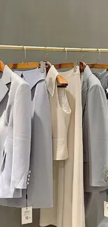 Pastel suits on a rack with elegant style.