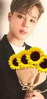 Stylish individual with sunflower bouquet against light background.