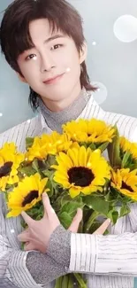 Person holding sunflower bouquet, sky blue background.