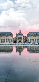 Elegant historical architecture reflected at sunset in tranquil setting.