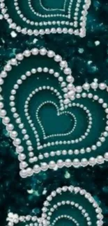 Teal background with pearl heart designs.