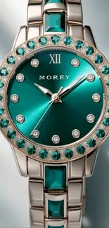 Elegant teal watch with silver details and gemstone accents.