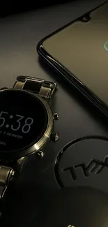 Sleek black watch and smartphone display.