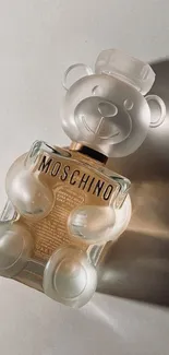 Moschino teddy bear-shaped frosted glass perfume bottle.