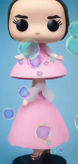 Toy figure in a pink dress with a blue backdrop, perfect for phone wallpaper.