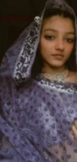 Elegant portrait of a woman in a traditional purple shawl.