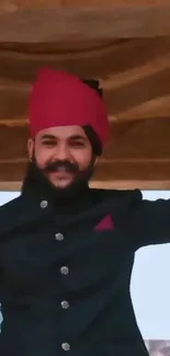 Man in traditional attire, red turban.