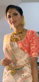 Woman in traditional attire with ornate jewelry.