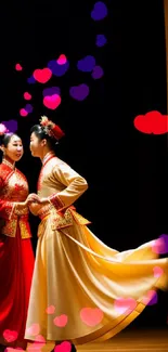 Traditional dancers in red and gold performing gracefully on stage.