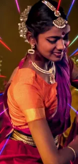 Woman in traditional Indian dance attire with vibrant colorful lines.