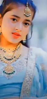 Elegant woman in traditional attire with intricate jewelry.