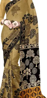 Elegant saree with tree design in brown tones.