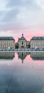 Elegant cityscape reflected on water at dusk.