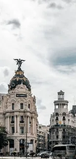 Elegant urban architecture with classic buildings and a dramatic sky.