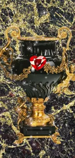 Elegant black vase with gold cherubs and red jewel on marble.