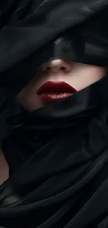 Black fabric wrapped around a face with red lips.