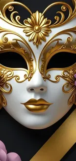 Venetian mask with gold accents and floral details on black background.