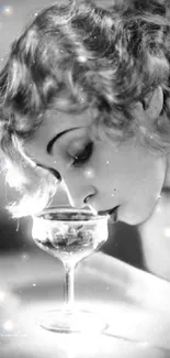 Vintage woman smiling while sipping champagne in elegant black & white photo.