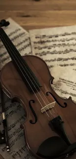 Violin resting on music sheets on a wooden table, creating a classical ambiance.