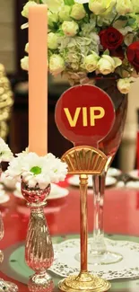 VIP table setting with red roses and candles.