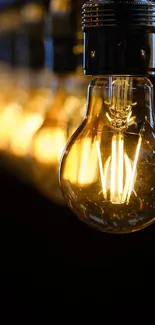 Elegant light bulb wallpaper with warm glow.
