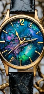 Elegant watch with opal-like dial and gold frame on artistic background.