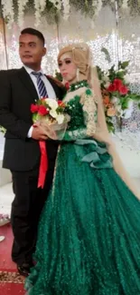 Elegant couple in wedding attire with green gown and floral decor.