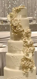 Elegant tiered wedding cake with floral decoration in ivory color.