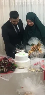 Wedding couple cutting cake, elegant decor, floral arrangements.