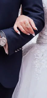 Wedding couple with pink rose bouquet on wedding day.